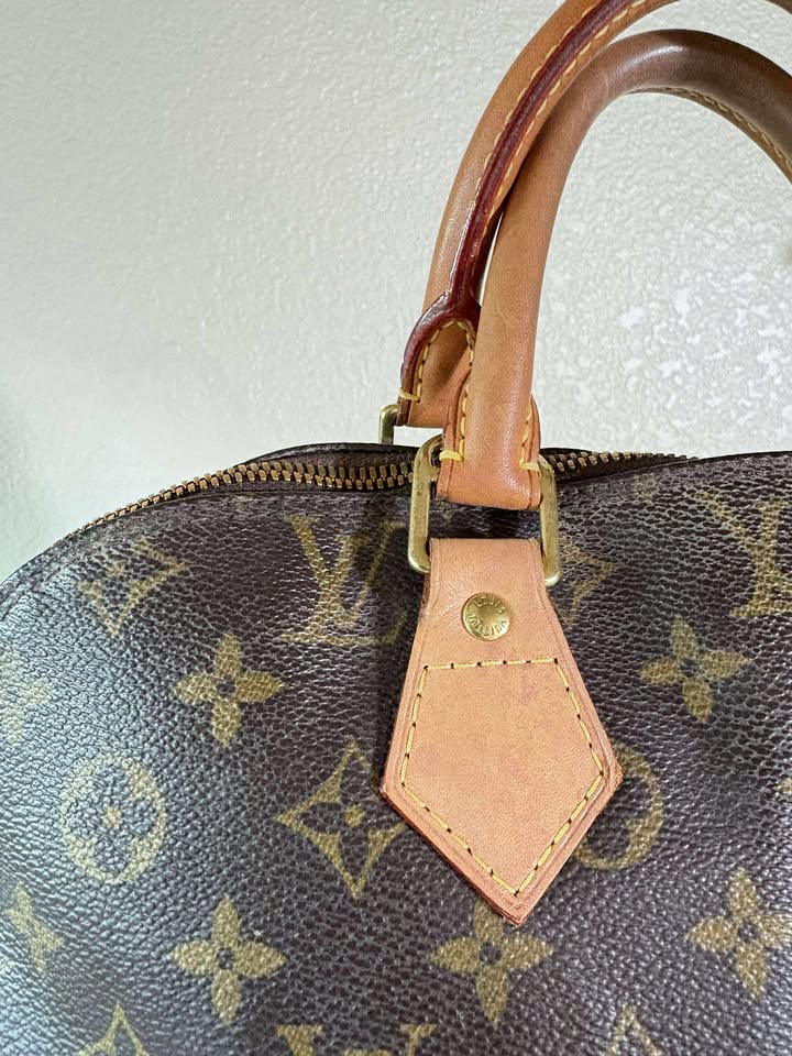 Louis Vuitton Alma MM Monogram Handbag
